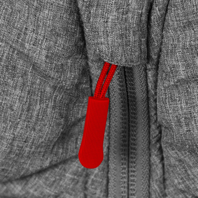A close-up of a grey puffer jacket featuring a red zipper pull. The fabric has a textured appearance.