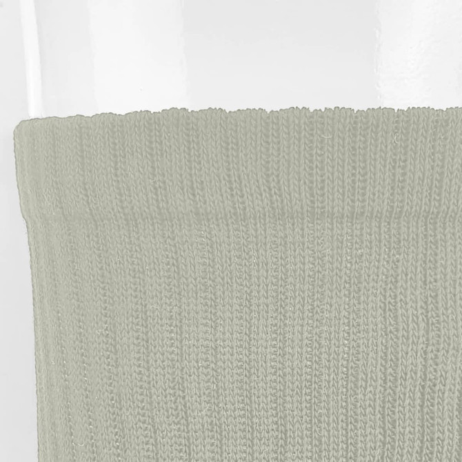 A pair of crew socks in a soft green colour, featuring a ribbed texture and a subtle logo.