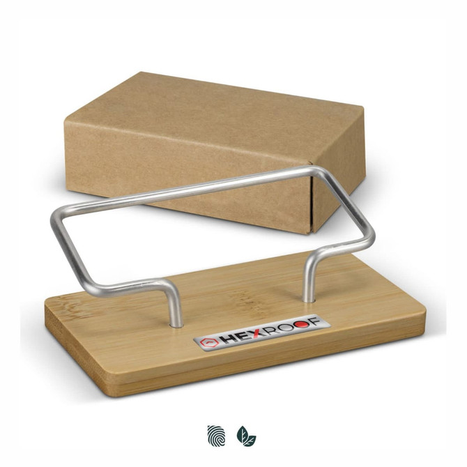 A bamboo business card stand with a silver metal holder, packaged in a plain cardboard box.