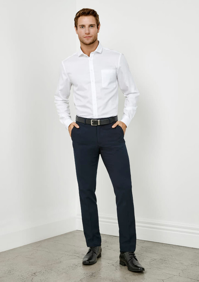 A pair of slim fit men's pants in navy, styled with a white shirt and a belt. There is branding visible.