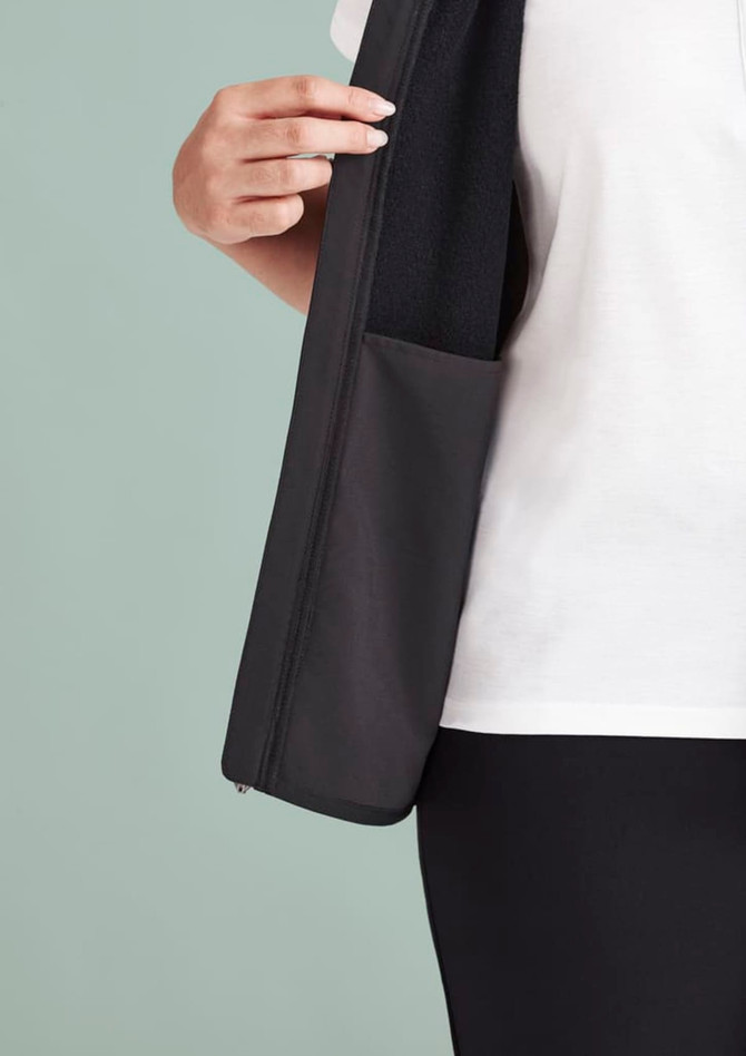 A black zip front vest featuring a pocket on the inside, designed for women's wear.