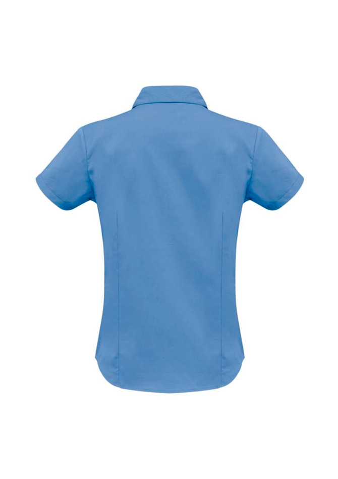 A women's short sleeve shirt in light blue with a curved hem and a collar, featuring a logo.