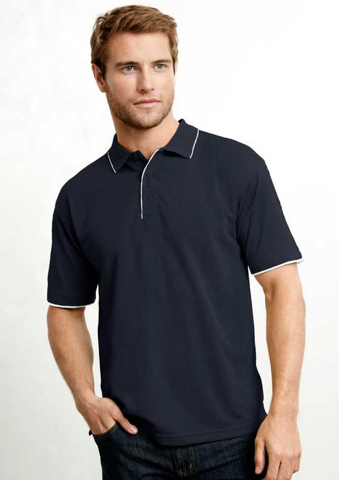 A short sleeve polo shirt in navy blue with white trim, featuring a collar and a logo. Styled on a male model.