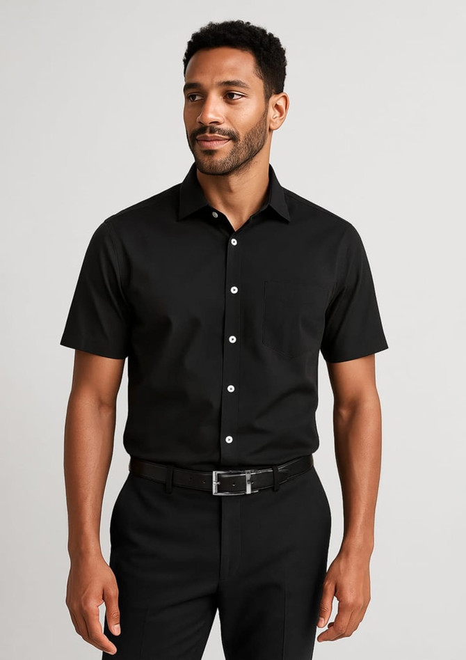 A black short-sleeve button-up shirt featuring a logo, worn by a man with a neutral expression.