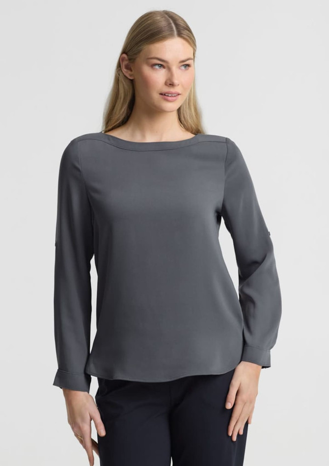 A grey women's boatneck top with long sleeves, featuring a simple design and a subtle branding element.