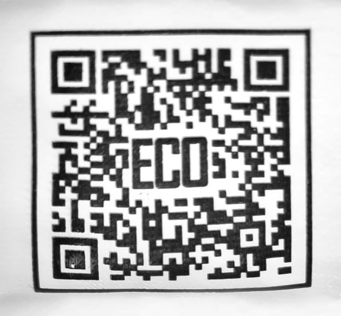 A QR code with a bold 'ECO' in the centre, featuring a black and white design.