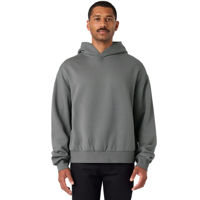 A grey hoodie with a front pocket and a logo, featuring an elasticated hem and oversized silhouette.