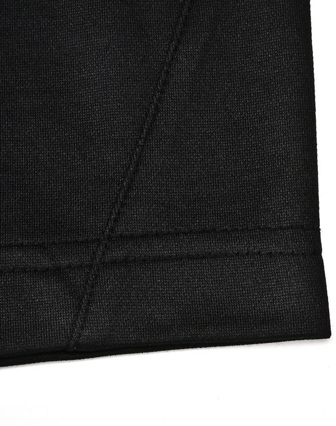 A close-up of a black polo shirt with a contrast sleeve hem and stitching detail. Features a logo on the side.