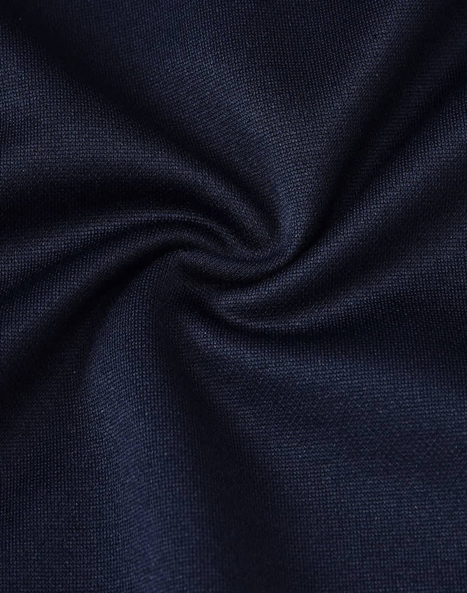 A close-up of navy fabric, showcasing a smooth texture with a slight sheen, ideal for shirts.