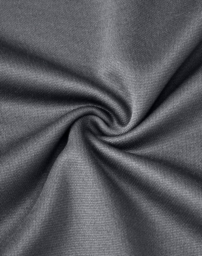 A close-up of dark grey fabric with a smooth texture, showcasing a sustainable poly/cotton blend.