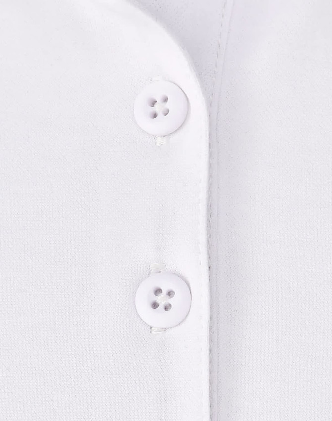 A close-up of a white polo shirt featuring two button closures and a smooth fabric texture.