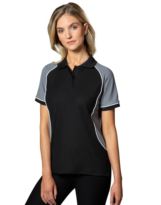 A black tri-colour polo shirt with grey and white accents, featuring a collar and short sleeves. It has a logo.