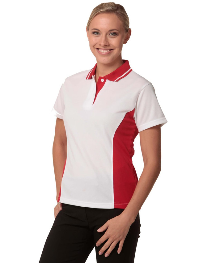 A white and red Ladies' TrueDry Contrast short-sleeve polo shirt displayed on a model, featuring a logo.
