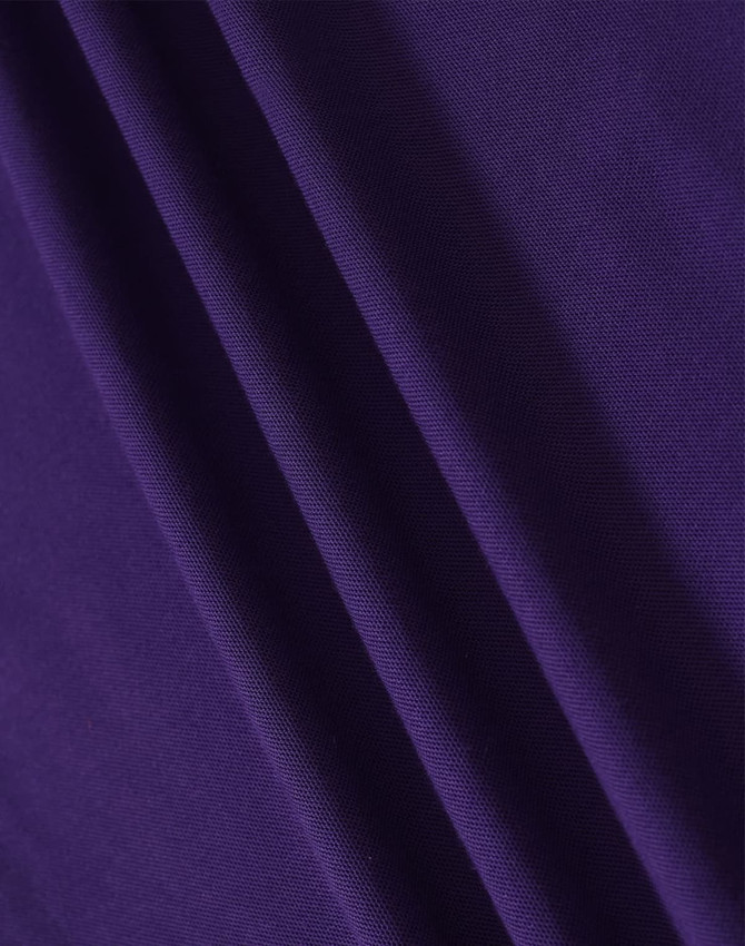 A close-up of fabric in a rich purple hue, showcasing the texture and depth of the material.