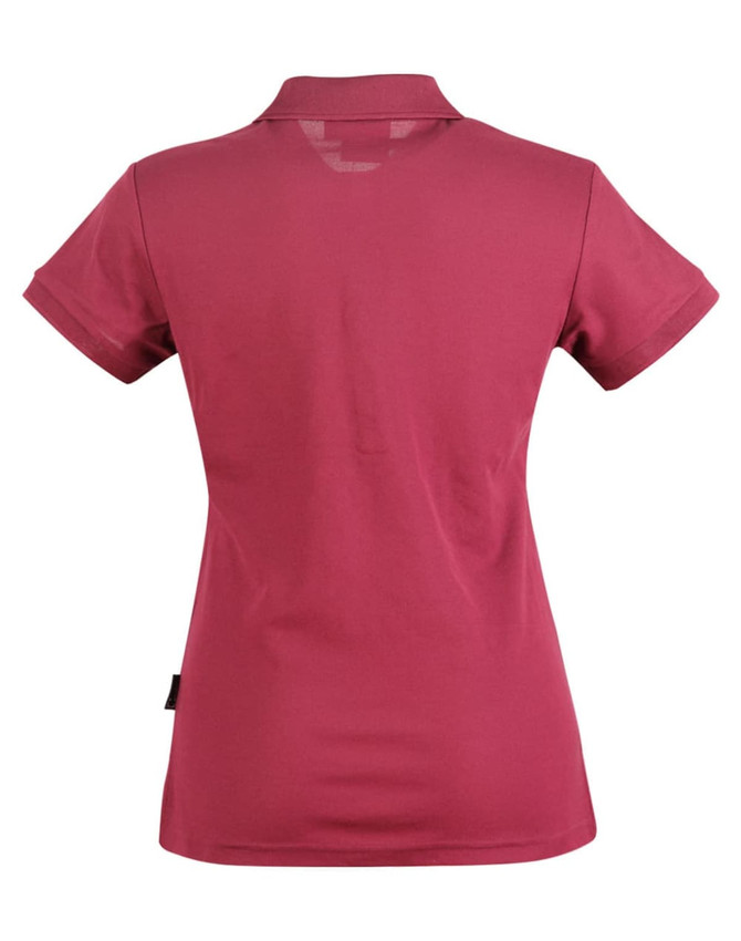 A maroon polo shirt for ladies featuring a classic collar and short sleeves. It has a branding logo on the side.