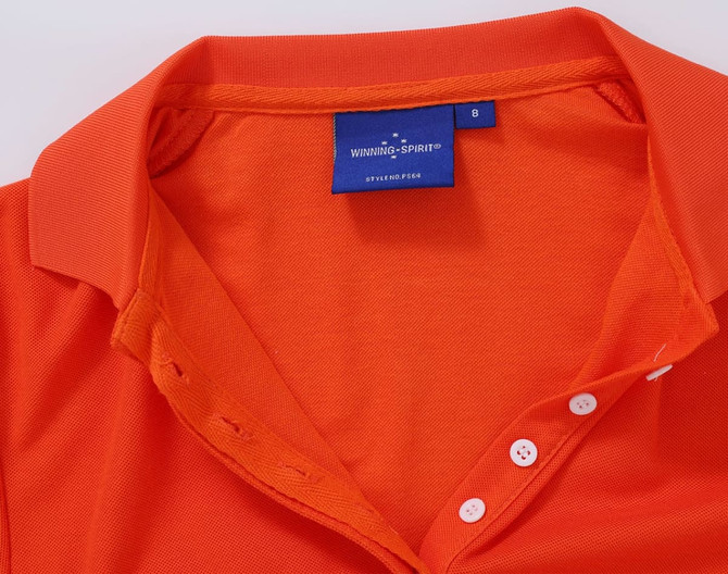 An orange polo shirt with a collar and buttons, featuring a label inside.