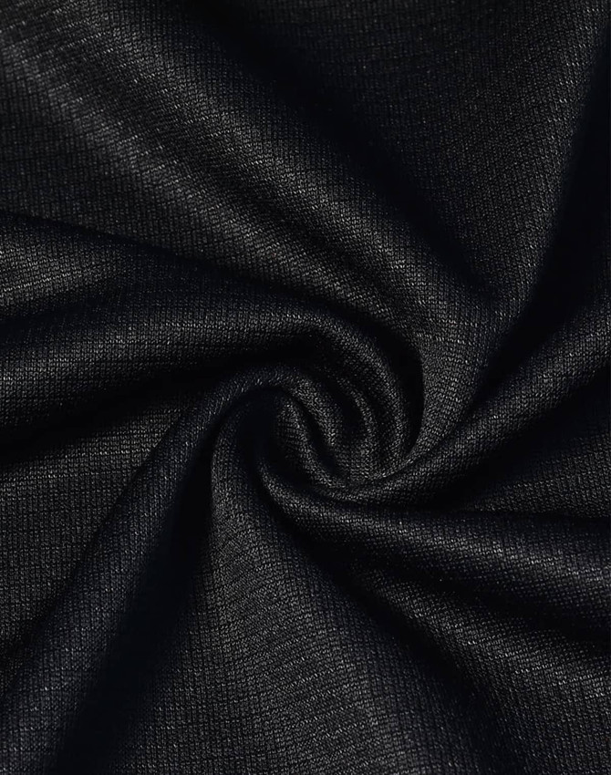 A close-up of black fabric with a textured finish, showcasing a spiral pattern. It appears lightweight and breathable.