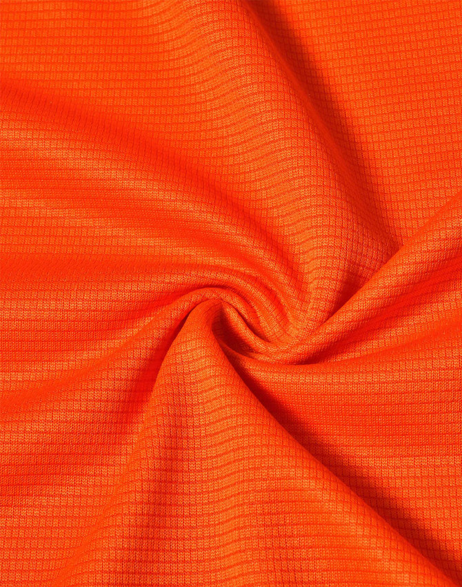 An orange fabric featuring a textured pattern, suitable for lightweight performance t-shirts.