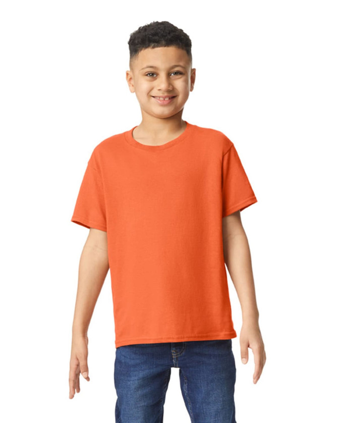 An orange youth T-shirt displayed on a smiling boy, featuring a basic design and a logo.