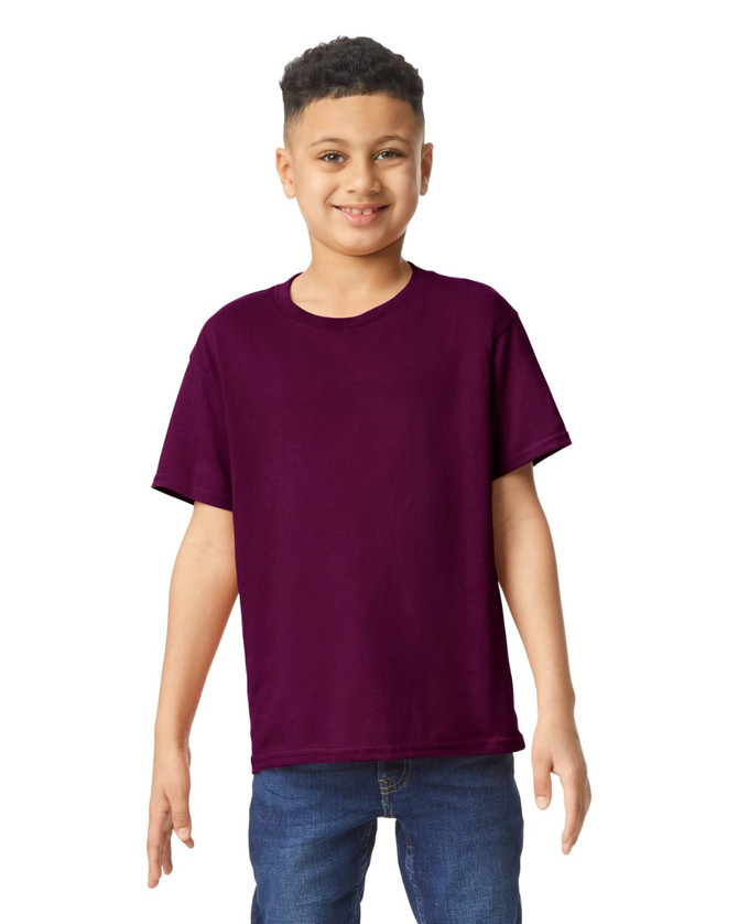 A youth t-shirt in a rich purple colour, worn by a smiling child, with a branding logo visible.