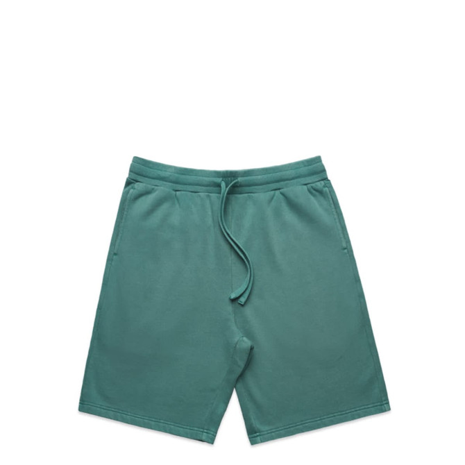 Faded green sports shorts featuring an elastic waistband and a logo.