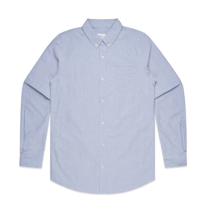 A light blue button-up Oxford shirt with long sleeves and a chest pocket. The shirt features a logo.