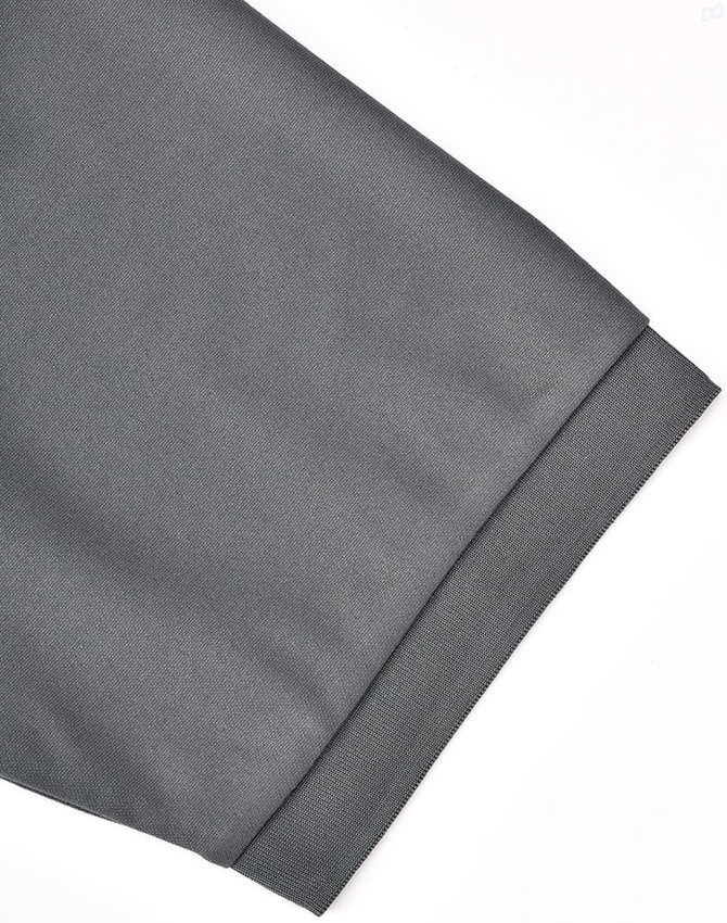 A grey polo shirt featuring a short sleeve with a neatly finished cuff and a logo.