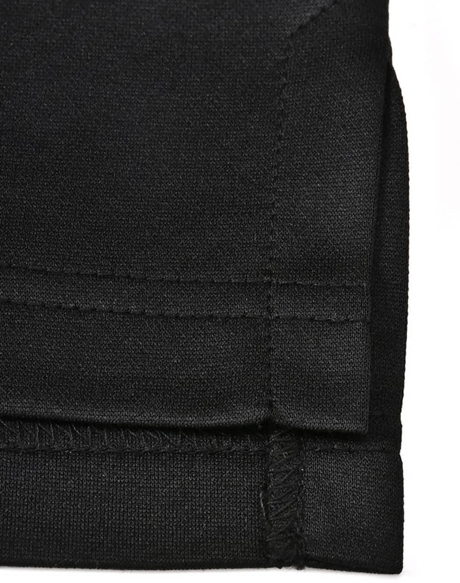 A black sustainable poly/cotton polo shirt with a neatly finished sleeve hem and stitching details.