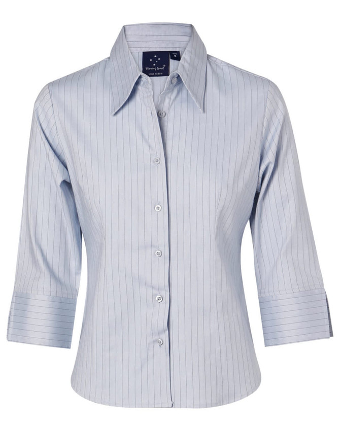 A light blue, long sleeve, button-up shirt with vertical stripes and a logo on the collar.