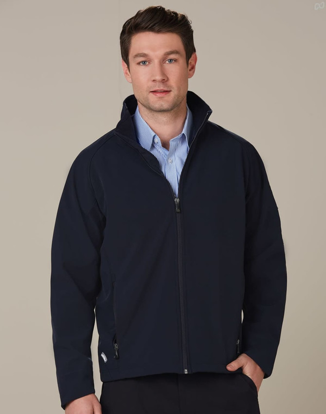A navy high-tech softshell jacket with a zip front, featuring a collar and side pockets, worn by a model.