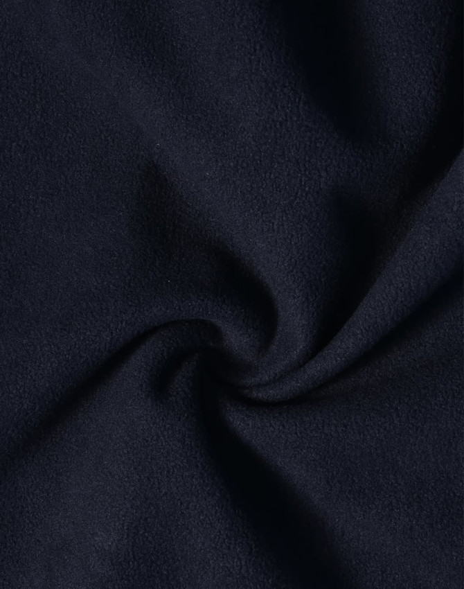 A close-up view of dark navy softshell fabric, featuring a smooth texture with a slight sheen.