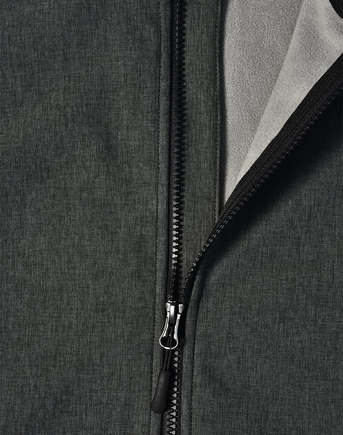 A softshell full zip hoodie in dark grey featuring a zip closure and interior fleece lining. It has a branding logo.