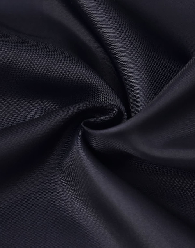 A black fabric with a smooth texture, showcasing the material of a puffer jacket.