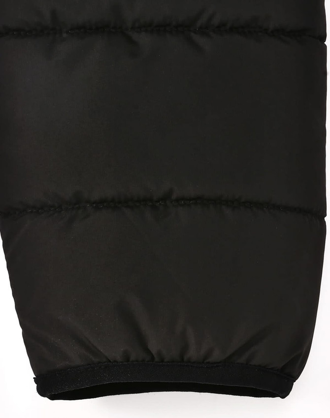 A black puffer jacket featuring a 3D cut with an elasticated hem, designed for insulation and sustainability.