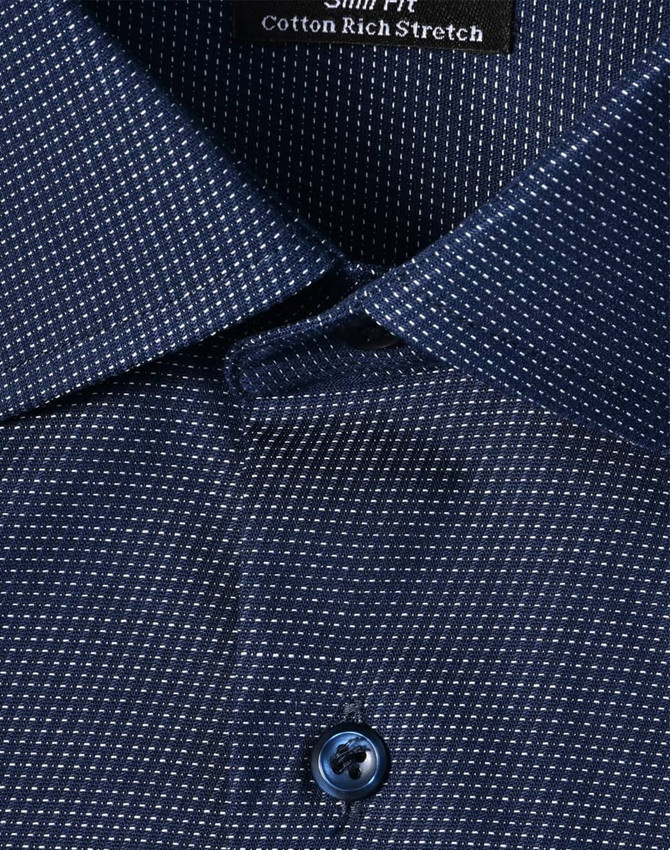 A navy blue men's button-up shirt featuring a pin dot pattern and a logo on the collar.