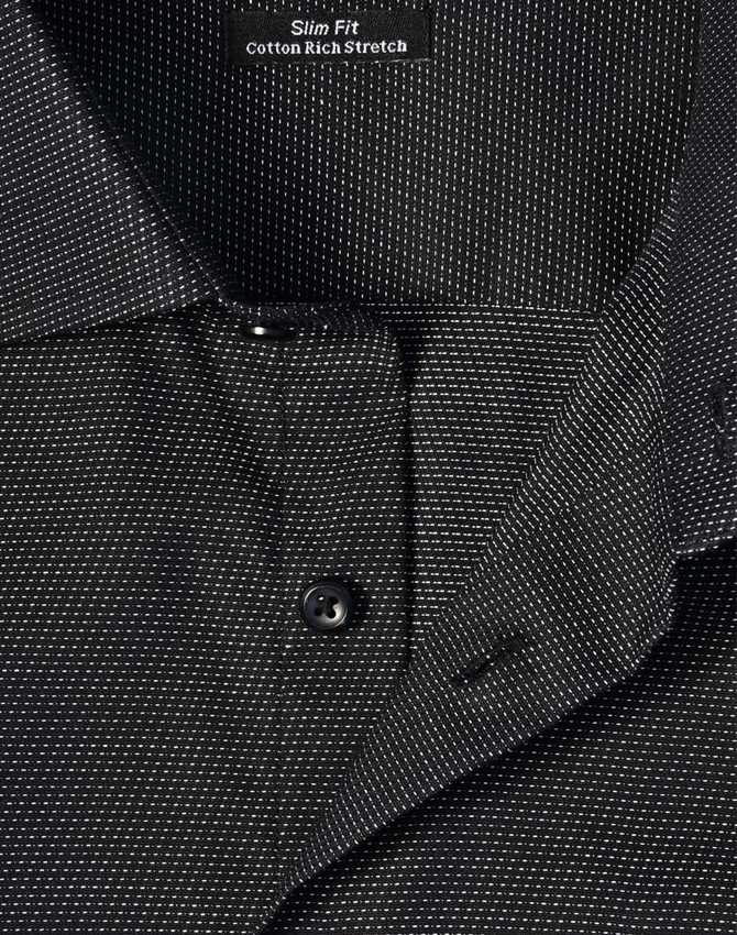 A close-up of a men's black pin dot stretch short-sleeve shirt featuring a slim fit and a collar with buttons.