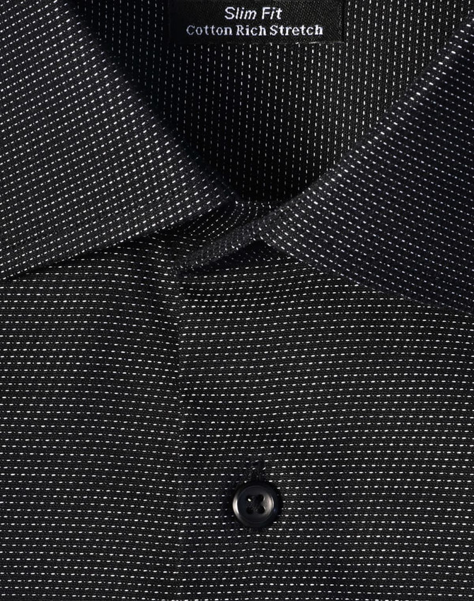 A black slim fit button-up shirt with a pin dot pattern and a collar, featuring a logo tag inside.