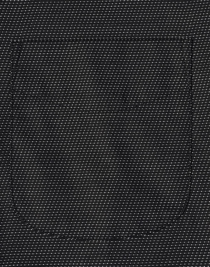 A black pin dot fabric with a pocket detail. The texture features small, contrasting dots.