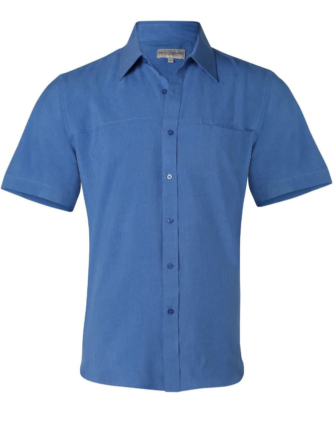 A men's short sleeve shirt in a shade of blue, featuring a button-down front and a patch pocket. It has a logo.