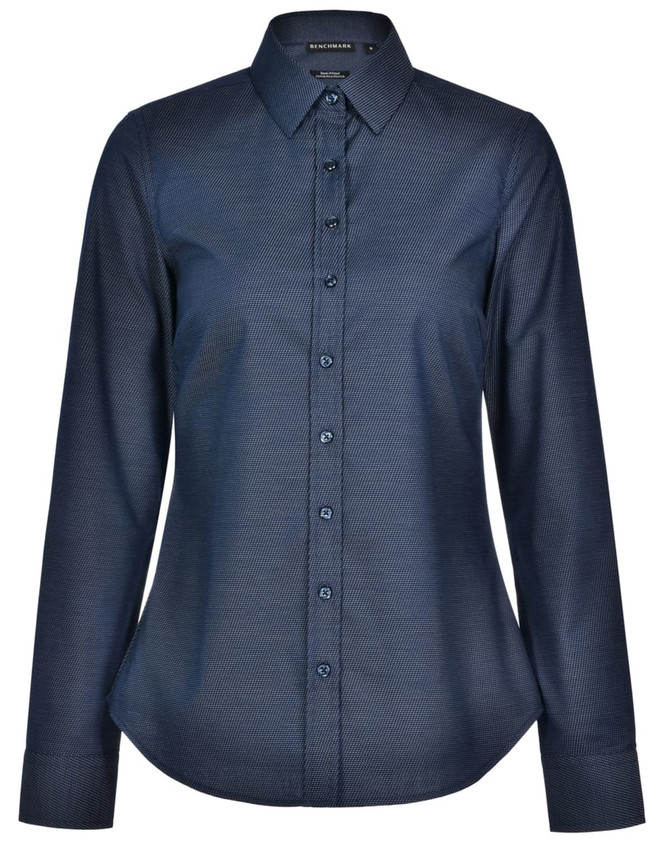 A navy blue long-sleeve button-up shirt with a pin dot pattern and a collared neckline. Features a logo on the label.