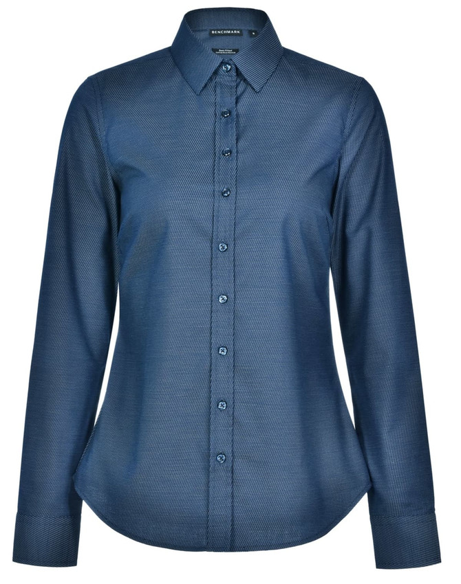 A long-sleeved, button-up shirt in dark blue with a pin dot pattern and a collar. It features a logo on the label.