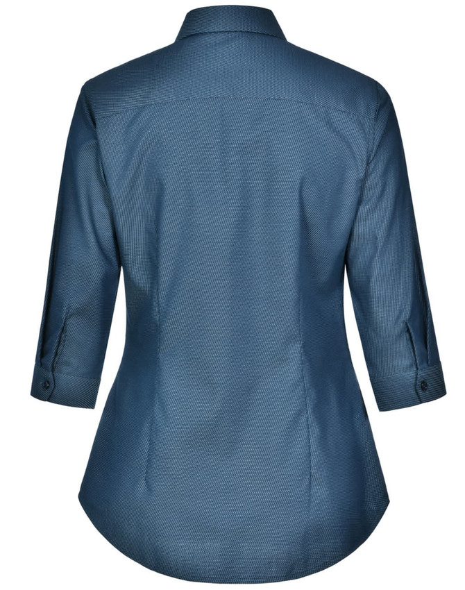 A women's button-up shirt in a blue pin dot pattern, featuring a 3/4 sleeve and a curved hem. It has a logo.