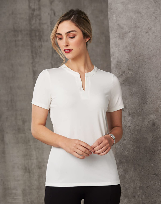 A white ladies' V-neck short sleeve knit top with a tab collar, featuring a fitted design and a subtle logo.