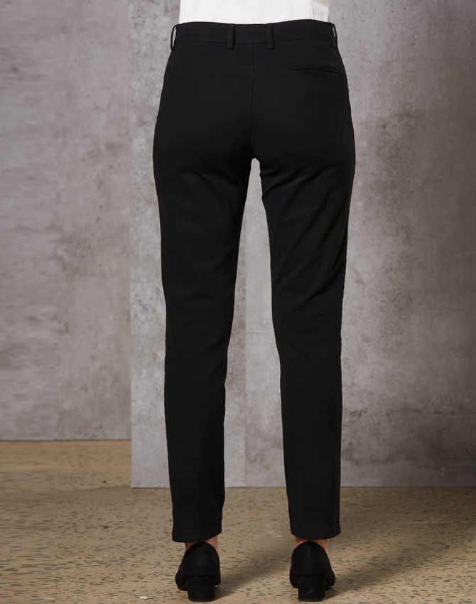 Black ladies' chino pants shown from the back, featuring a sleek fit and pockets. Includes a logo on the waistband.