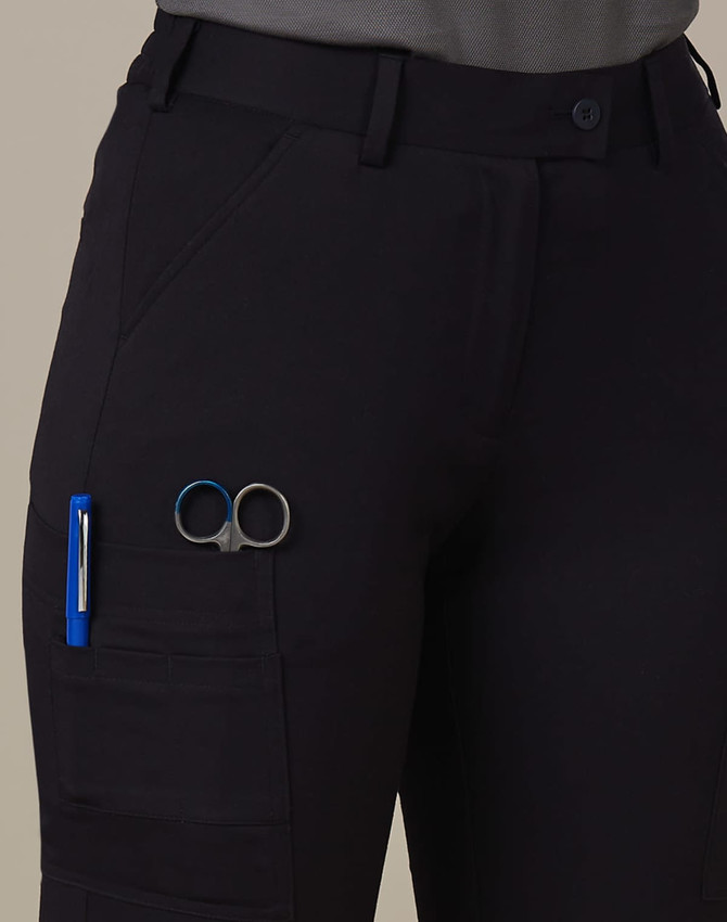 A pair of black ladies' utility cargo shorts with pockets, featuring a pen and scissors attached.