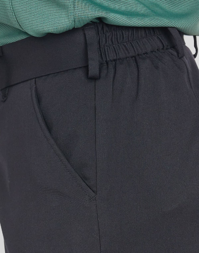 Ladies' utility cargo shorts in black featuring side pockets and an elastic waistband. Includes branding.