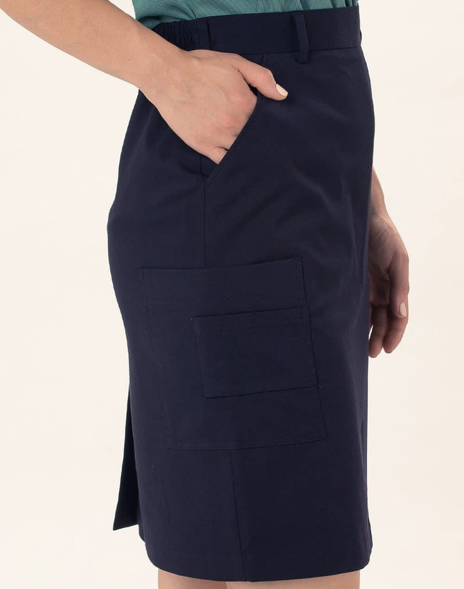 A navy utility cargo skirt with side pockets and a side slit. The fabric is smooth and structured.