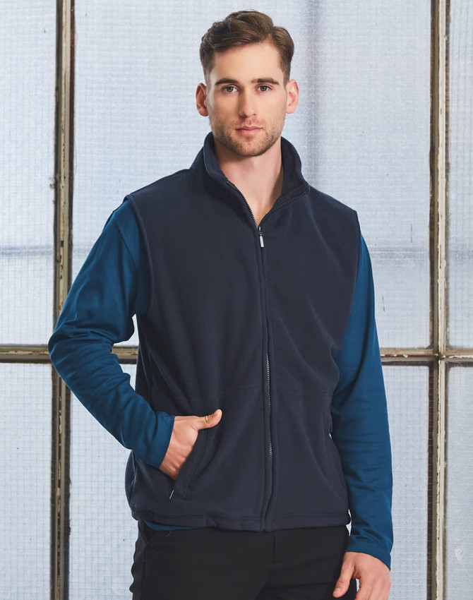 A navy unisex polar fleece vest with a high collar, front pockets, and a zip closure. Features a branding logo.