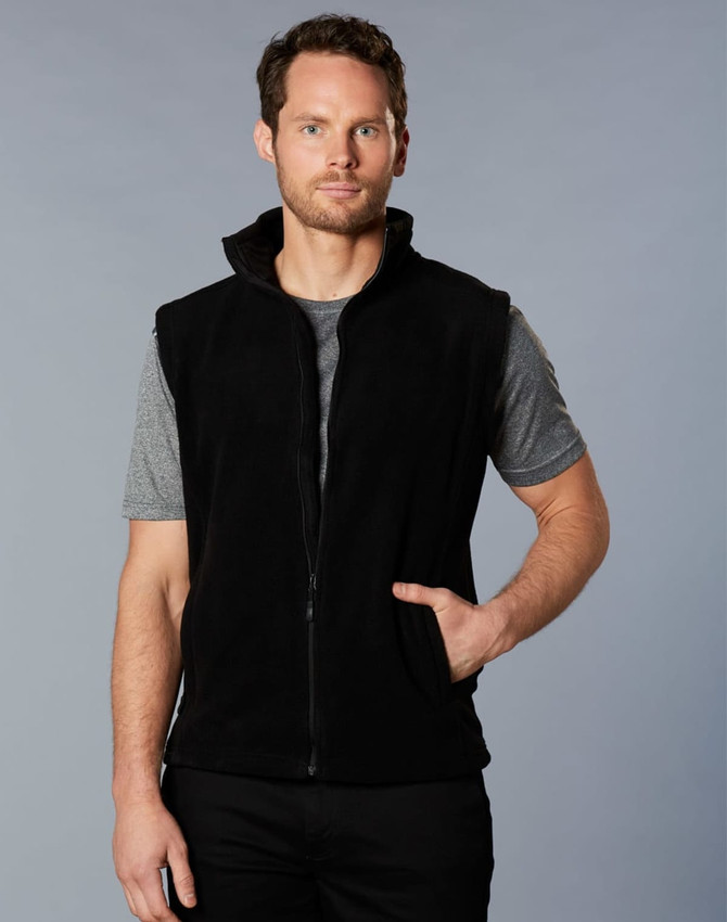 A black polar fleece vest with a high collar, featuring a front zip and side pockets, worn by a male model.