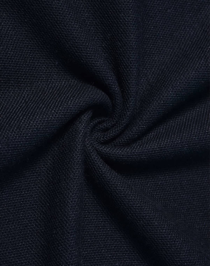 A close-up of dark navy fabric, showcasing a textured, woven pattern.